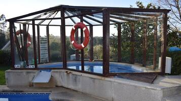 Outdoor pool, a waterfall pool, sun loungers