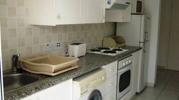 Fridge, microwave, electric kettle, cookware/dishes/utensils