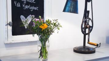 A window with a chalkboard displaying text and a mechanical device on a counter.