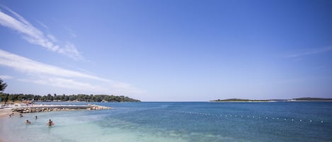 Beach nearby, white sand, sun-loungers, beach umbrellas
