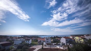 A residential area with houses and a clear sky.