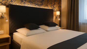 Sengetøy av topp kvalitet, minibar, safe på rommet og skrivebord