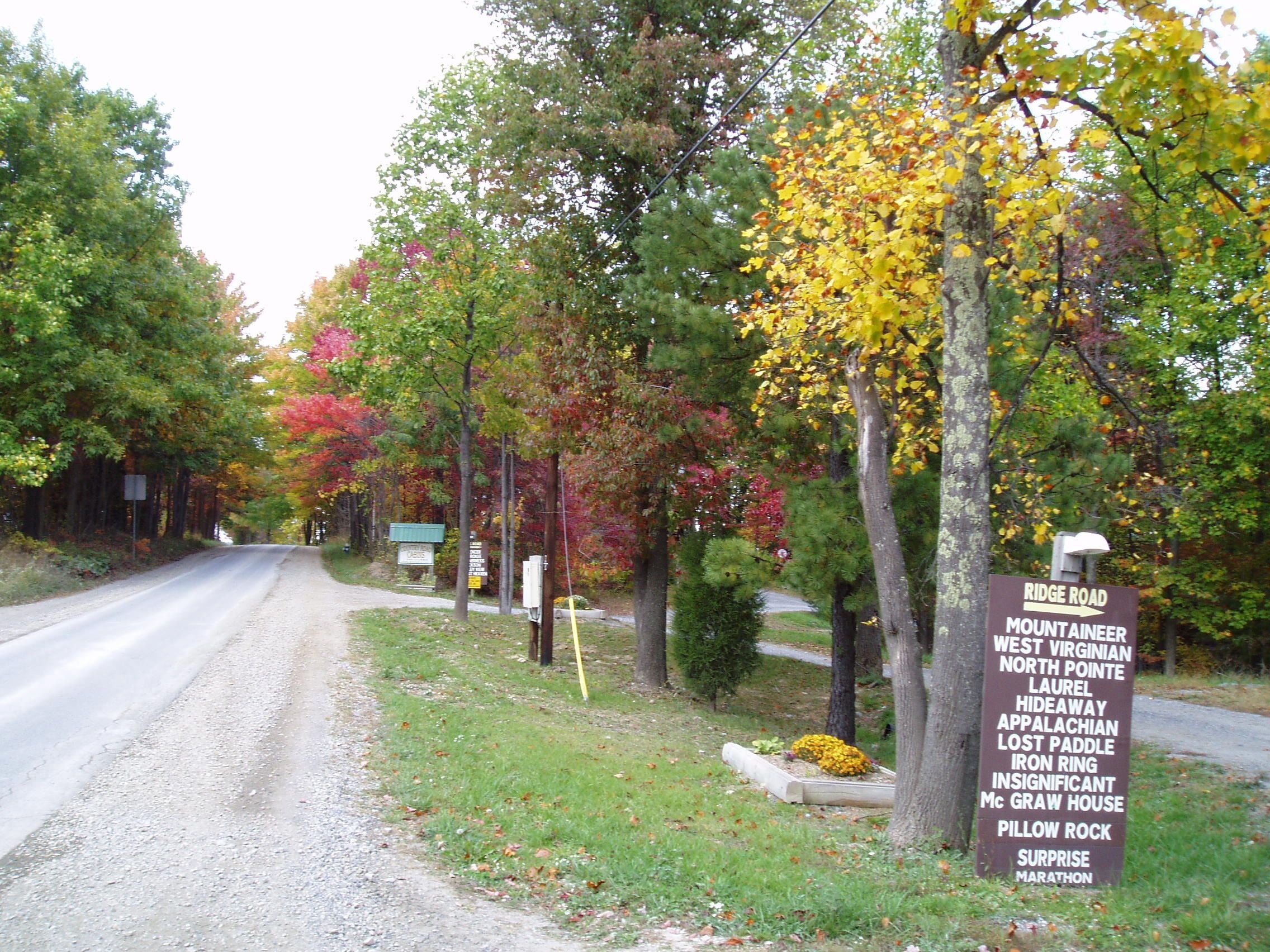 A roadside sign listing nearby attractions such as West Virginia, North Pointe, Laurel, and more.
