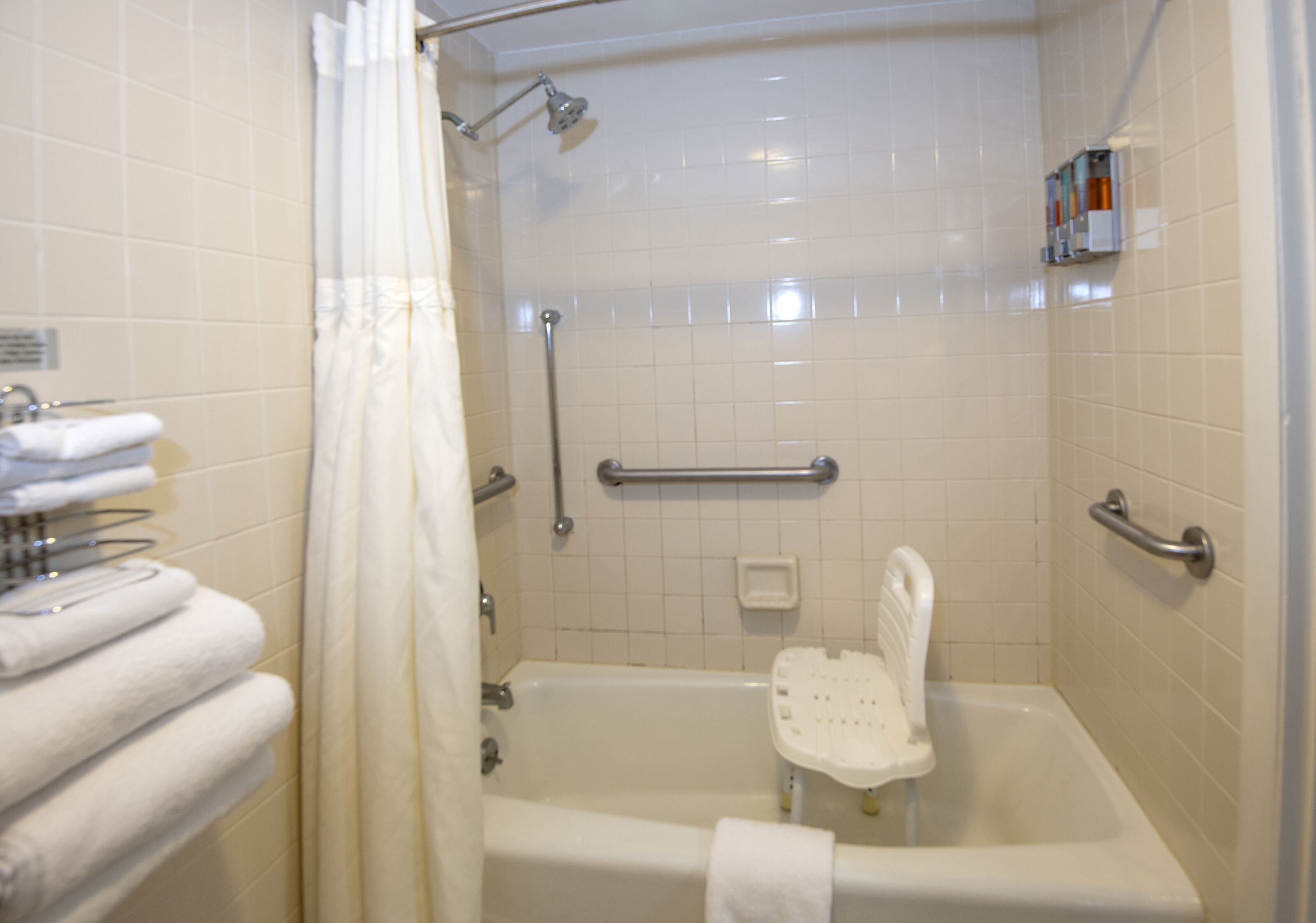 A bathroom with a bathtub, a shower, and a toilet.