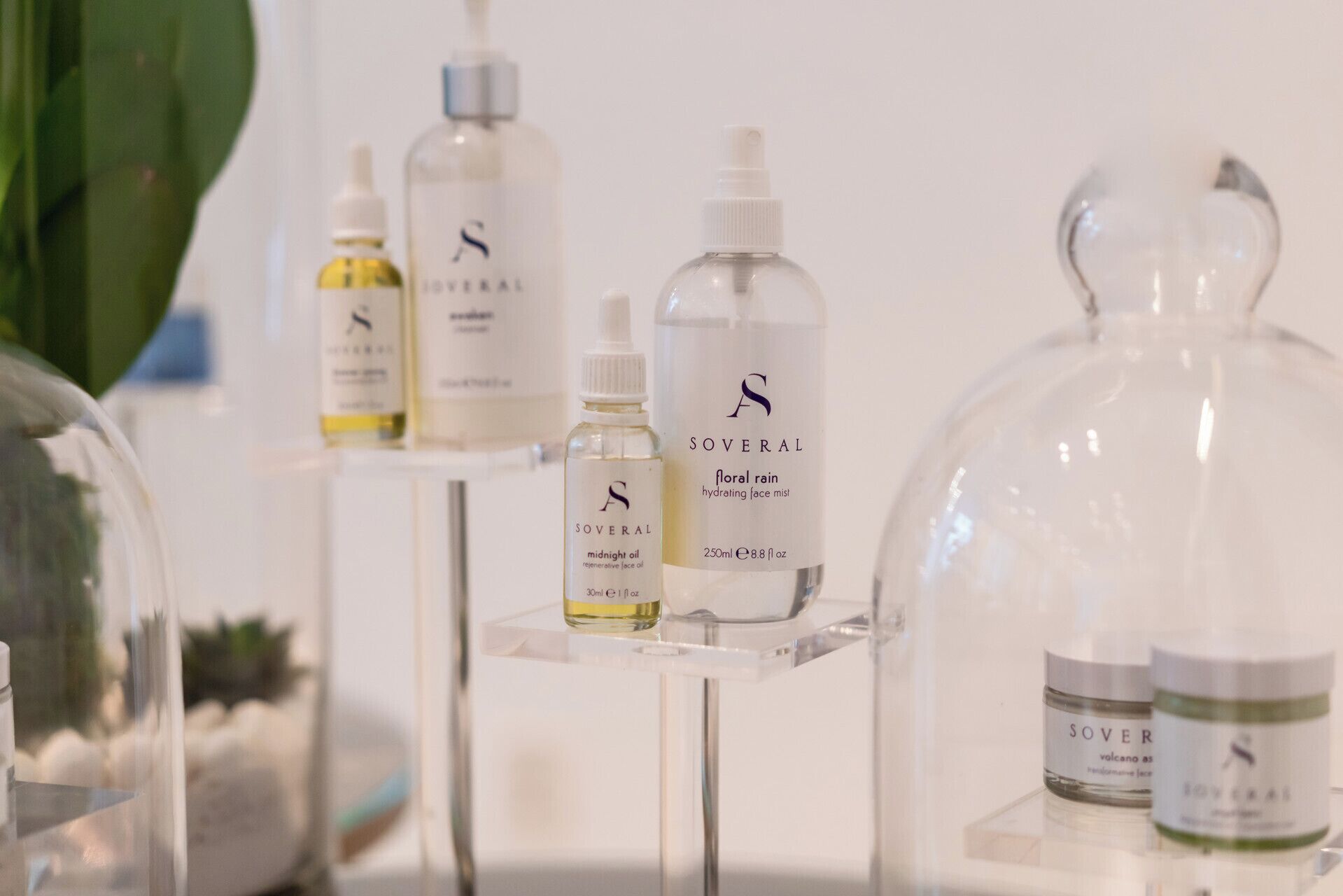 A display of various skincare products with labels and packaging.