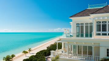 On the beach, white sand, beach umbrellas, beach towels
