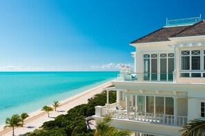 On the beach, white sand, beach umbrellas, beach towels - The Shore Club Turks and Caicos (Providenciales)