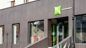 A modern hotel facade with a prominent green sign for 'ibis Styles Hotels'. - ibis Styles Gniezno Stare Miasto (Gniezno)