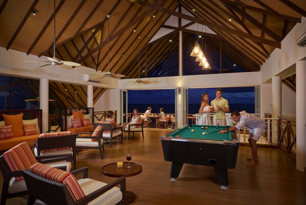 A spacious indoor area with a pool table, comfortable seating, and large windows offering views of the outside. - Mercure Maldives Kooddoo Adult-Only Resort (Kooddoo)
