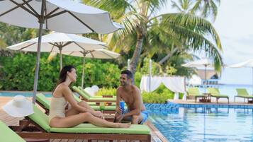 Outdoor pool, open 7:00 AM to 9:00 PM, pool umbrellas, sun loungers