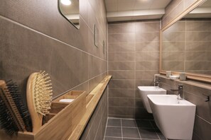 A modern bathroom with wooden vanity, two sinks, and a large mirror. - Blueboat Hostel Jeonju (Jeonju)