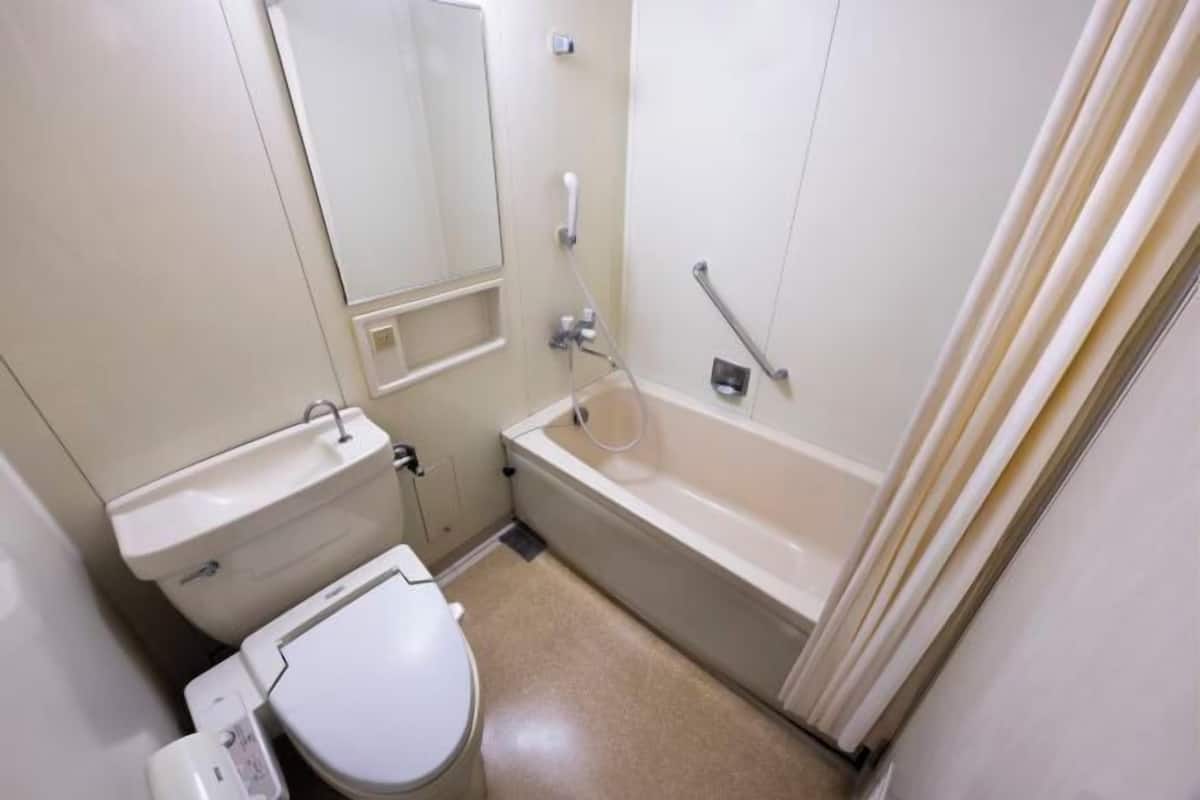 Bathroom | Shower, free toiletries, hair dryer, slippers