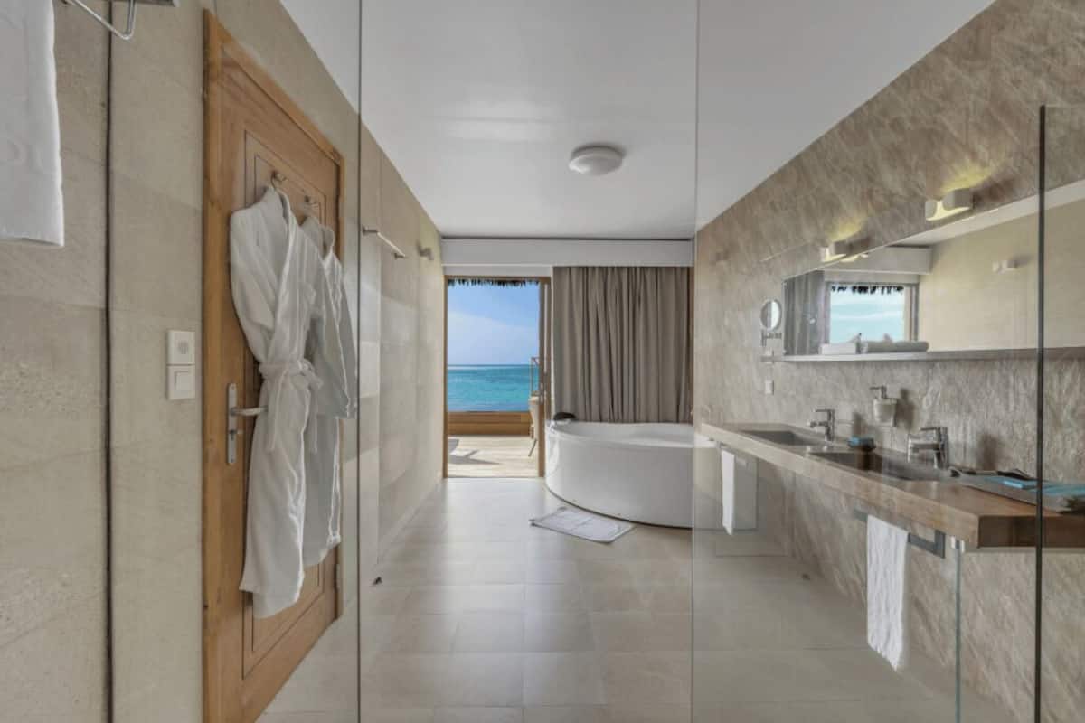 lagoon suite with pool | bathroom | shower, rainfall showerhead, eco-friendly toiletries, hair dryer
