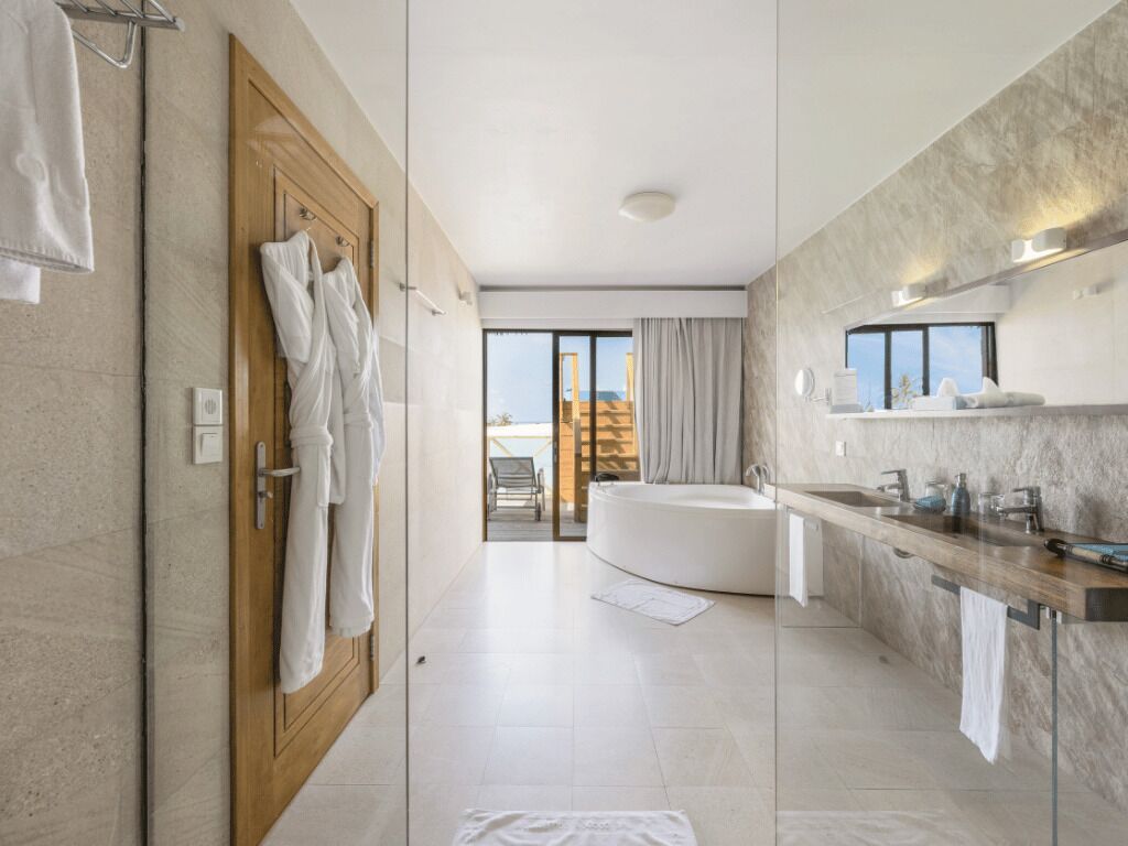 lagoon suite with slide | bathroom | shower, rainfall showerhead, eco-friendly toiletries, hair dryer