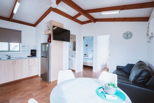 Superior 2 Bedroom Cabin | Living area | 30-inch flat-screen TV with digital channels, TV, DVD player