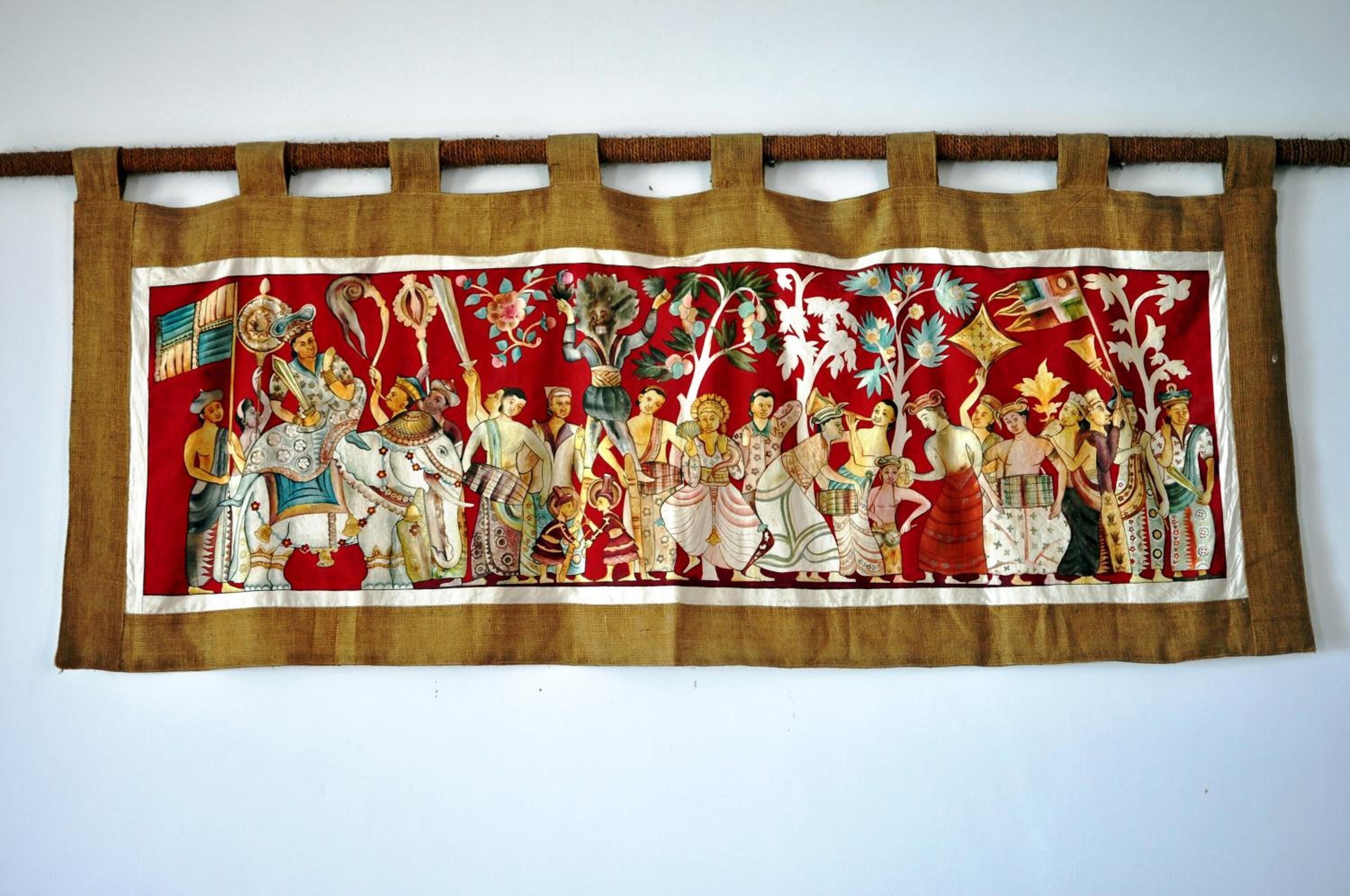 A tapestry with a red background and figures in traditional attire.