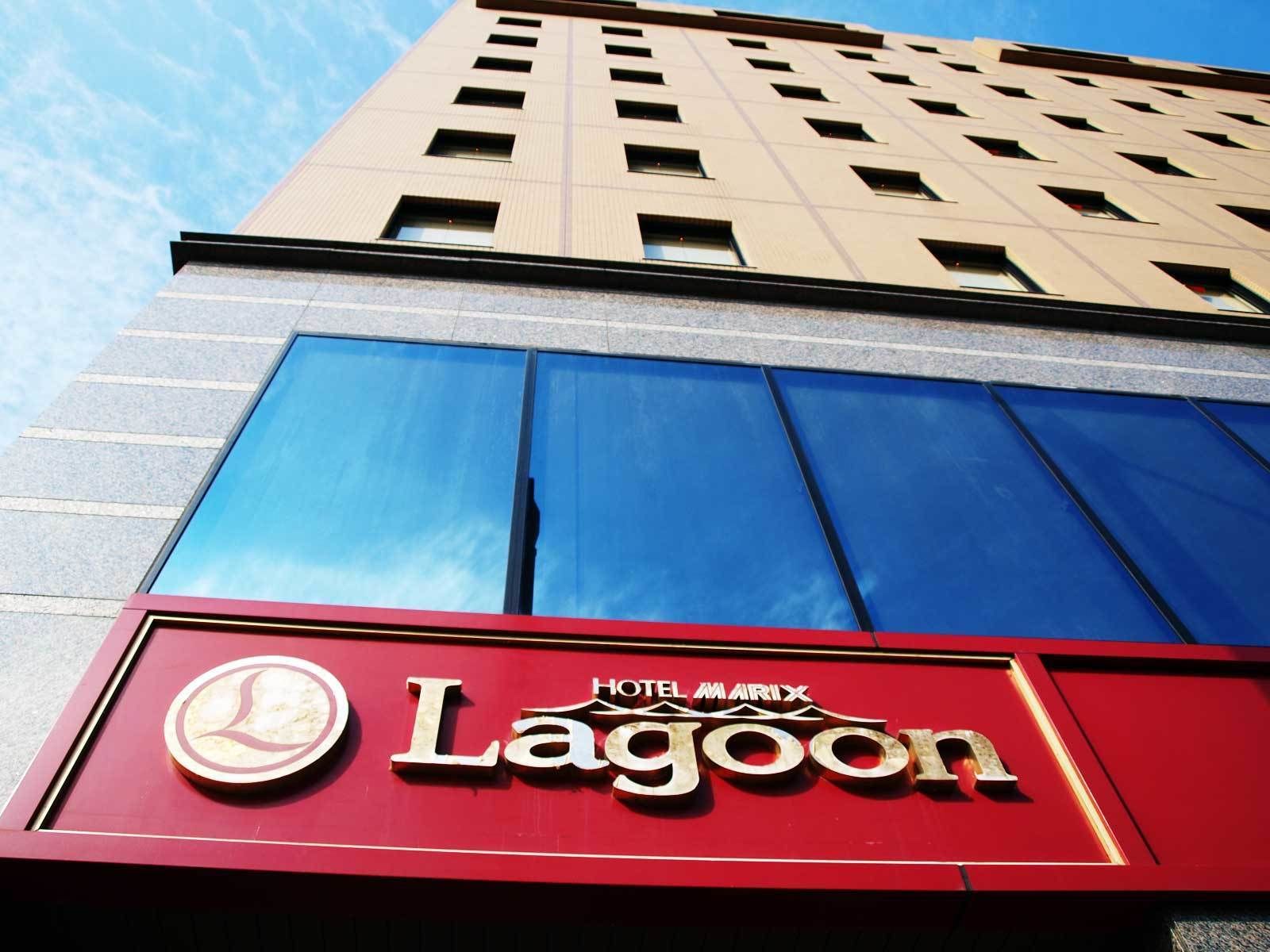 A hotel sign with the name "Hotel Marina Lagoon" and a logo.