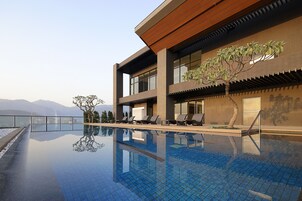 Outdoor pool, open 7 AM to 10 PM, sun loungers, lifeguards on site