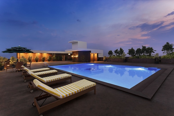 Outdoor pool, open 6:00 AM to 6:00 PM, pool umbrellas, sun loungers