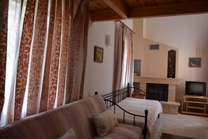 Standard Apartment (Triple) | Living area | TV - Rastoni Apartments (Andros)