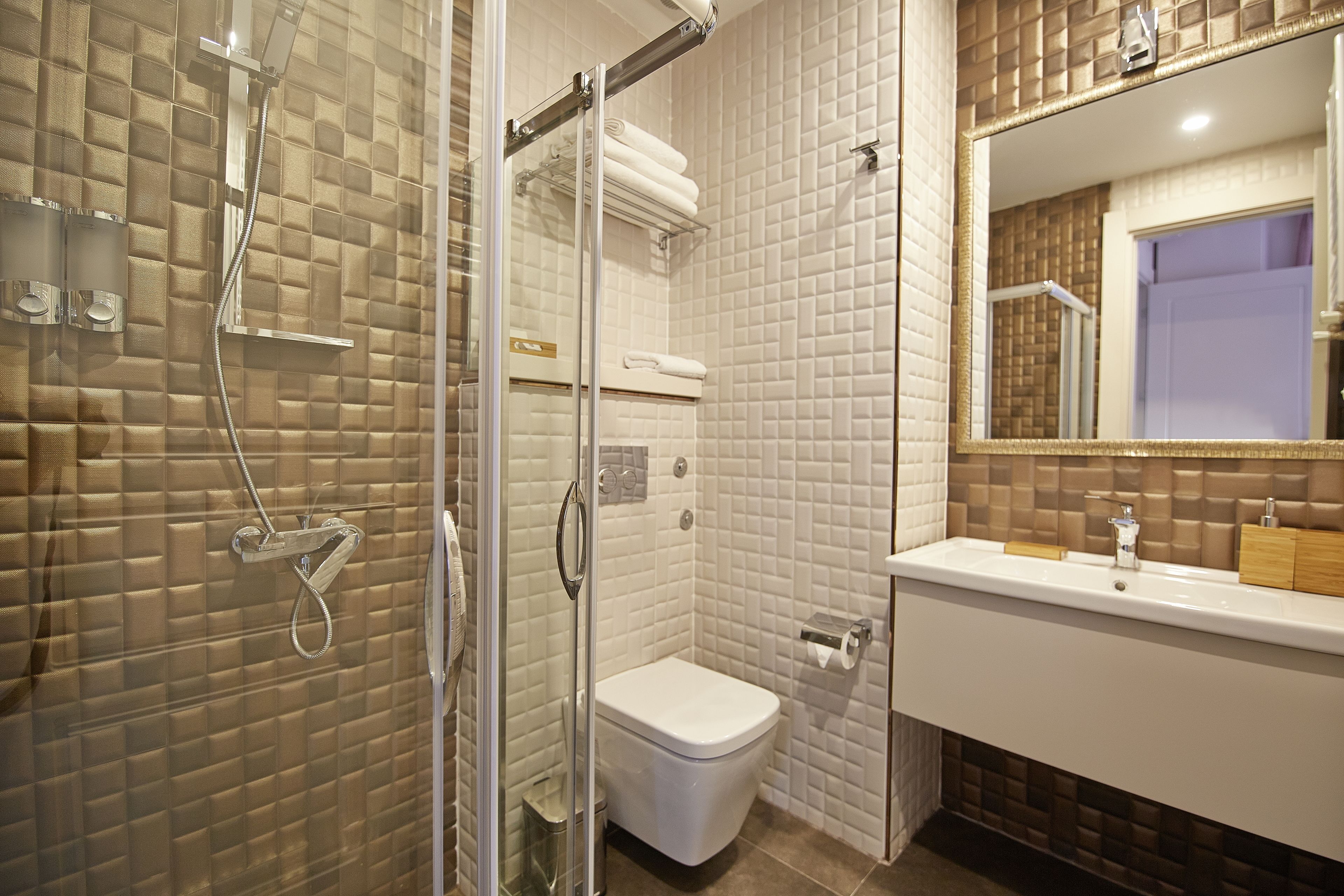 deluxe room | bathroom | shower, free toiletries, hair dryer, slippers