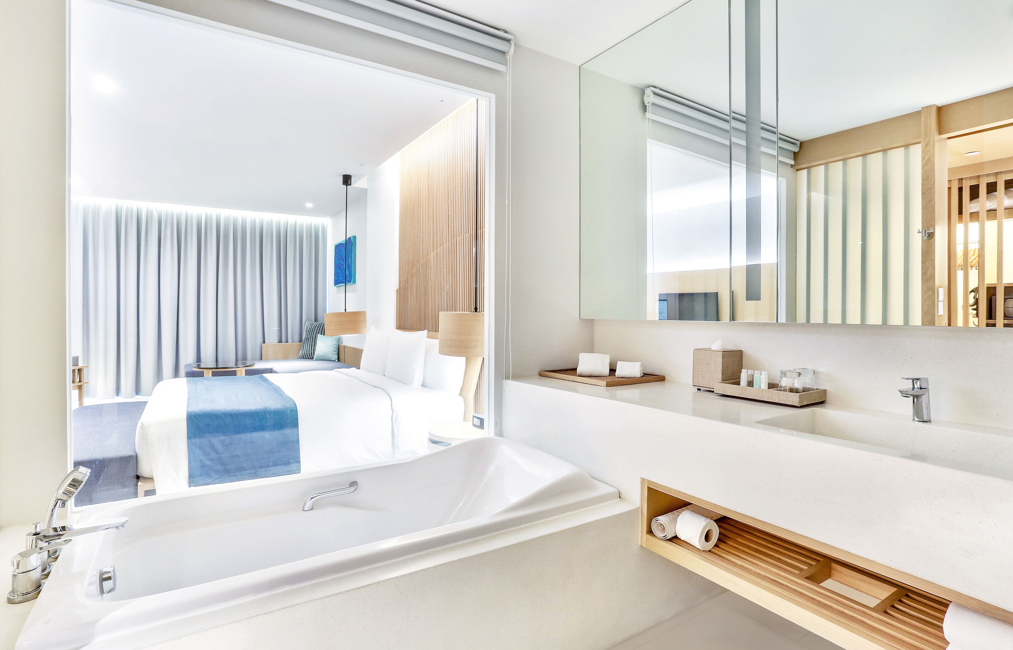 deluxe room | bathroom | separate bathtub and shower, designer toiletries, hair dryer, bathrobes
