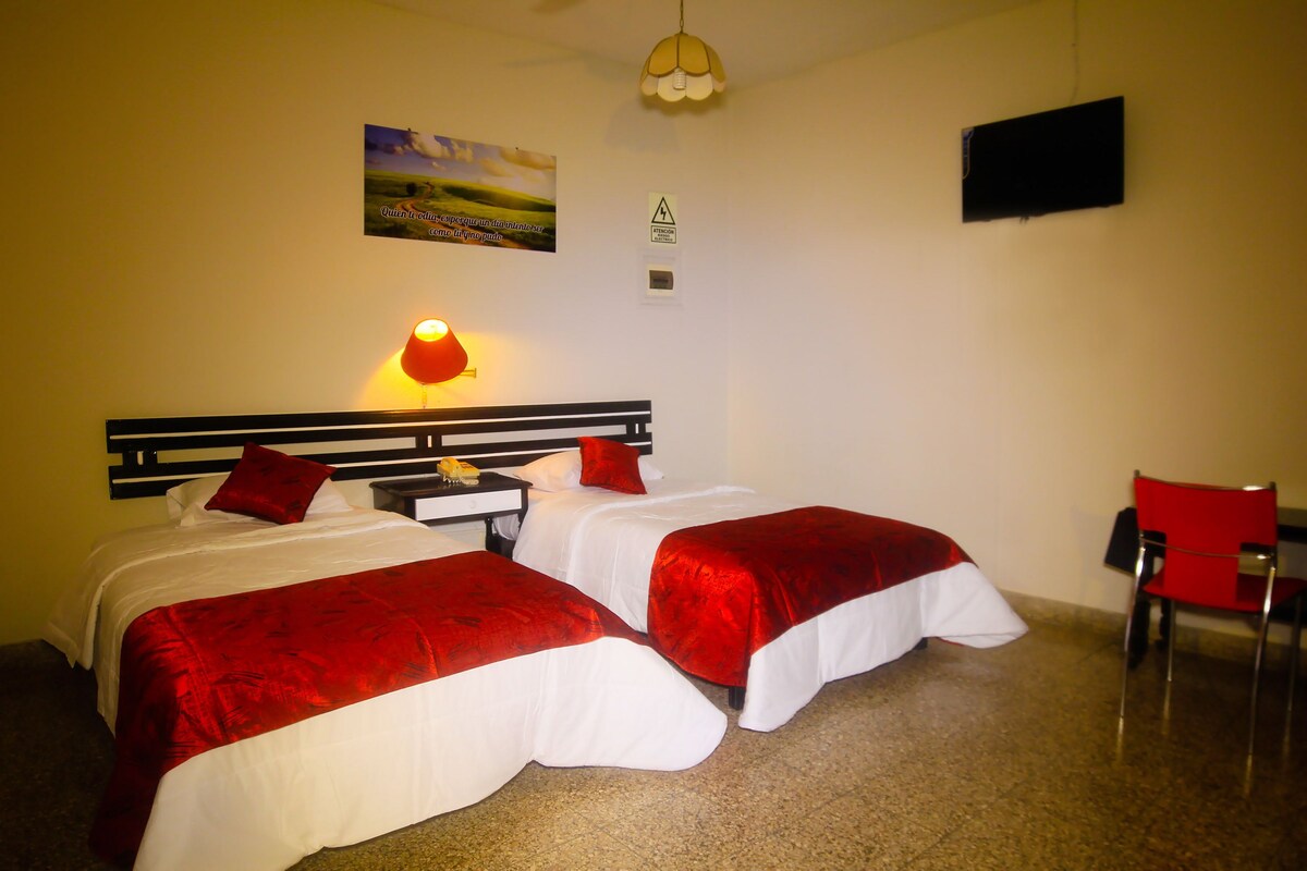 Twin Room | Minibar, in-room safe, desk, iron/ironing board