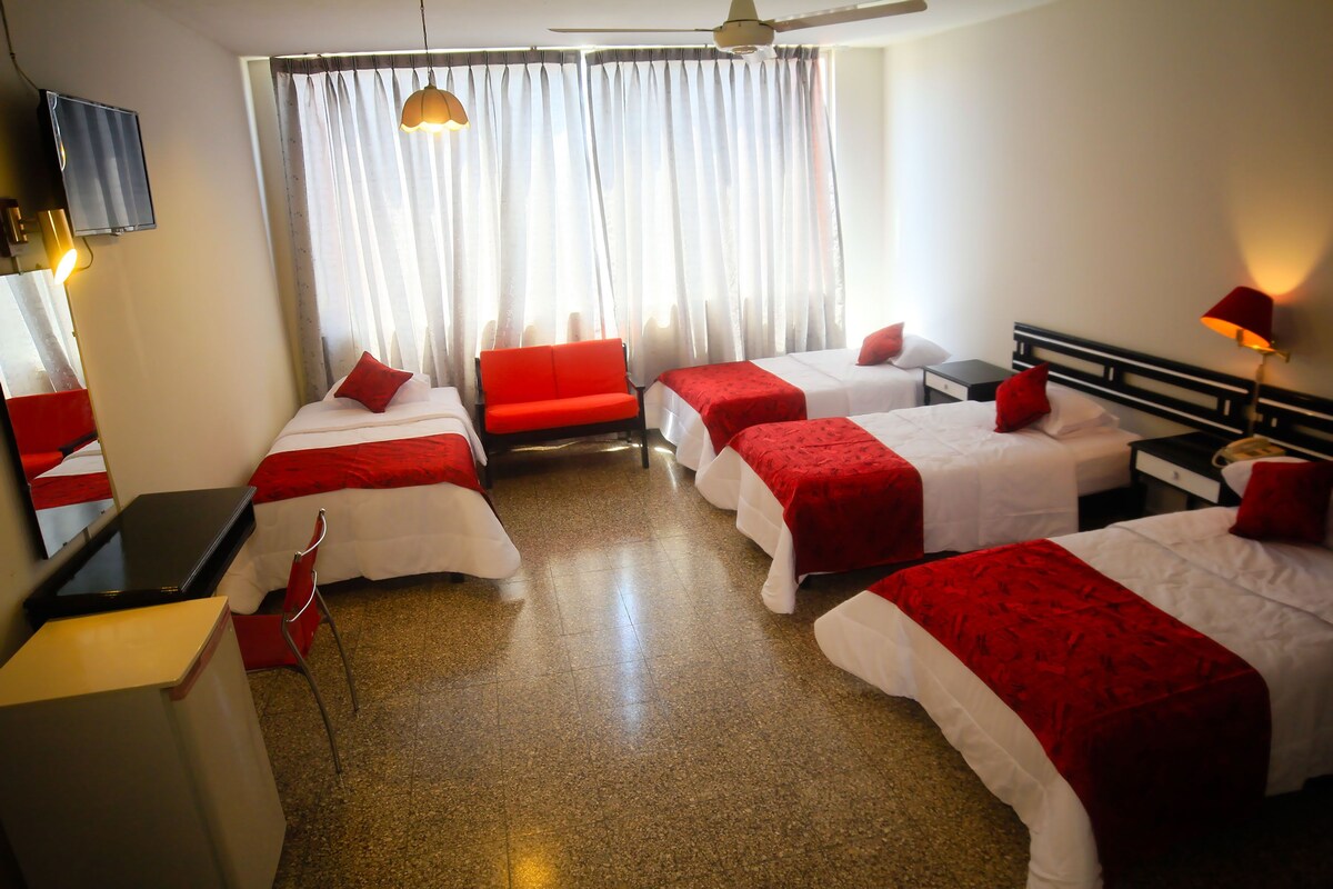 Quadruple Room | Minibar, in-room safe, desk, iron/ironing board