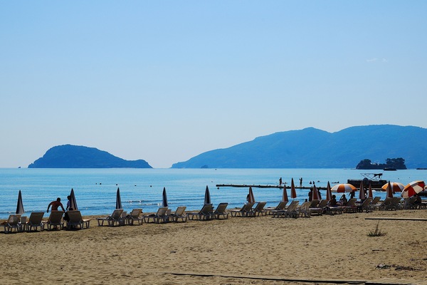On the beach, sun loungers, beach umbrellas