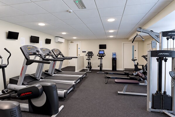 A gym with treadmills, elliptical machines, and weightlifting equipment. - Nant Ddu Lodge Hotel & Spa by Belvilla (Merthyr Tydfil)