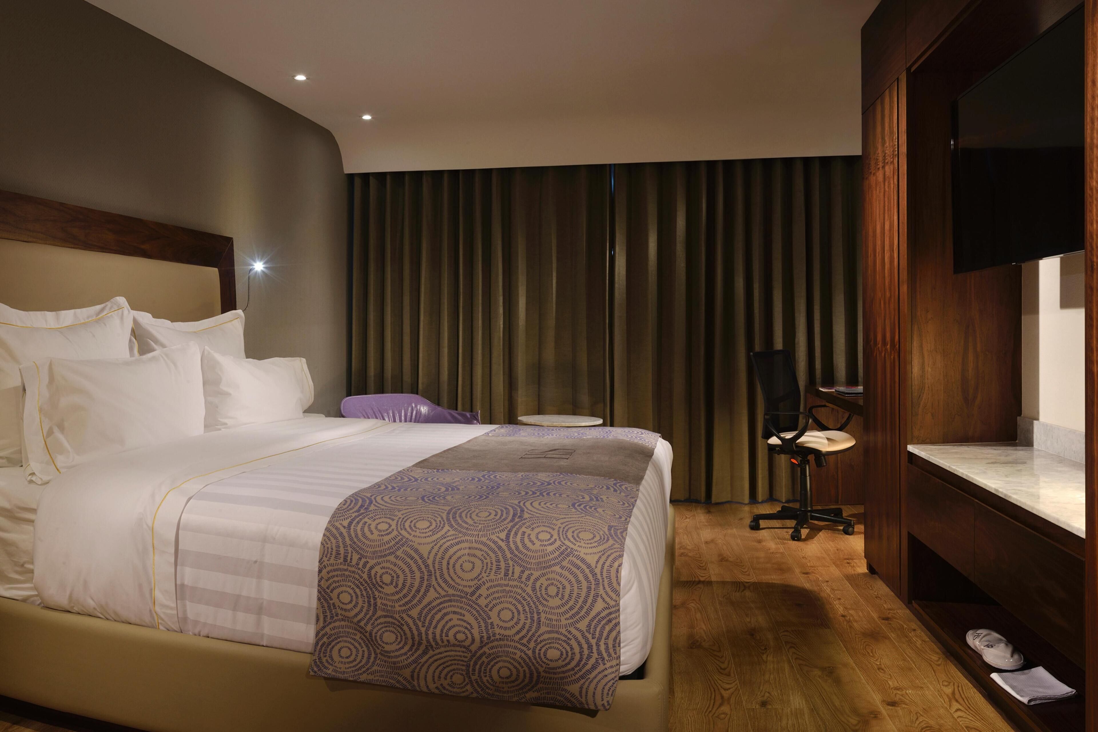 Premium bedding, in-room safe, desk, soundproofing