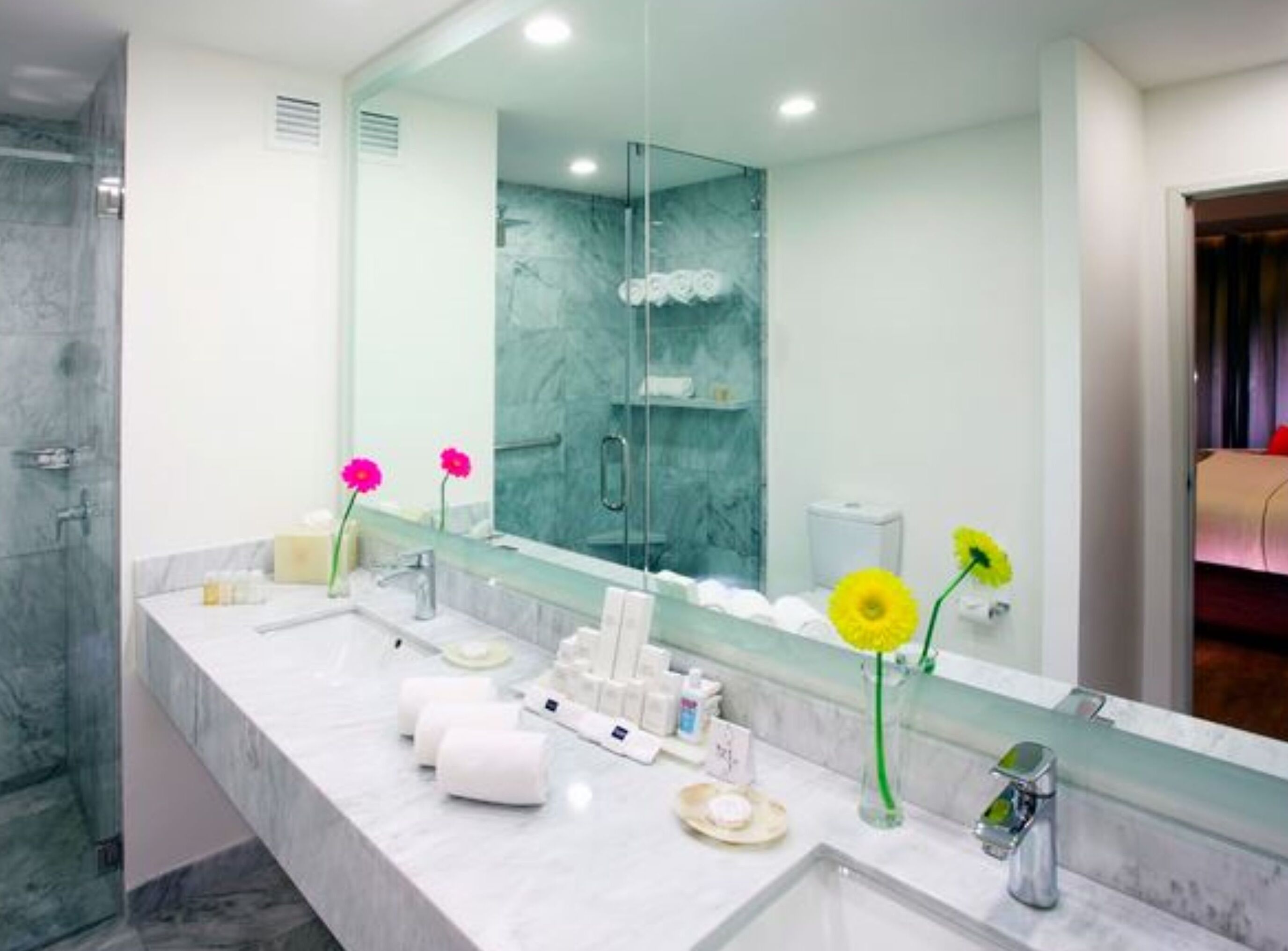 junior suite, 1 king bed, microwave, tower (deluxe junior) | bathroom | separate bathtub and shower, rainfall showerhead, designer toiletries