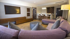 Junior Suite, 1 King Bed, Microwave, Tower (Deluxe Junior) | Living area | 48-inch LED TV with cable channels, TV, iPod dock