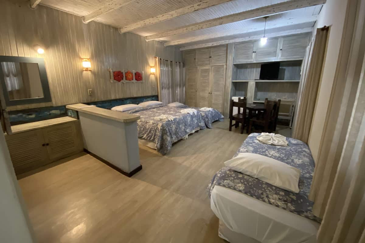 Quadruple Room | Minibar, in-room safe, blackout curtains, iron/ironing board