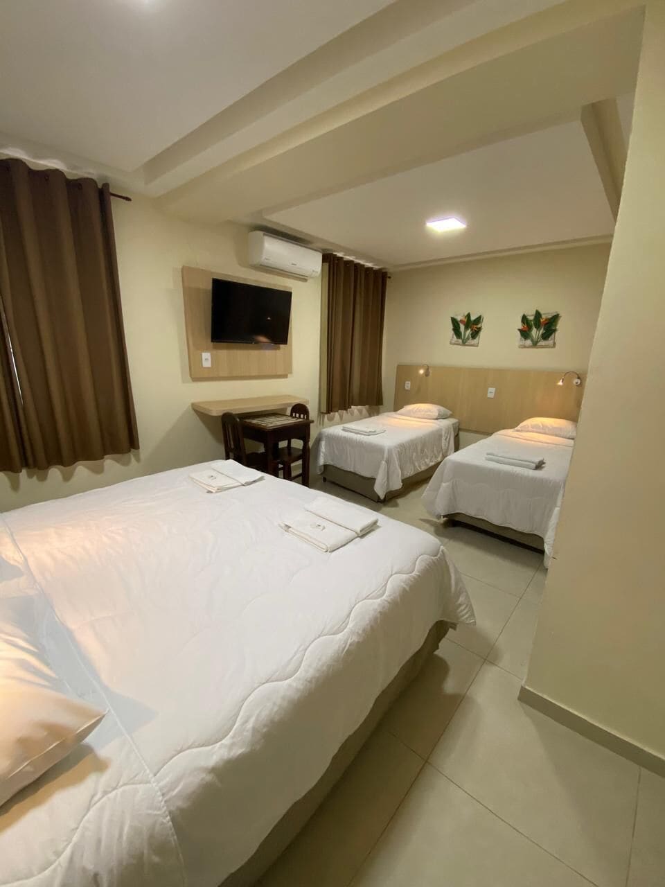 Quadruple Room | Minibar, in-room safe, blackout drapes, iron/ironing board