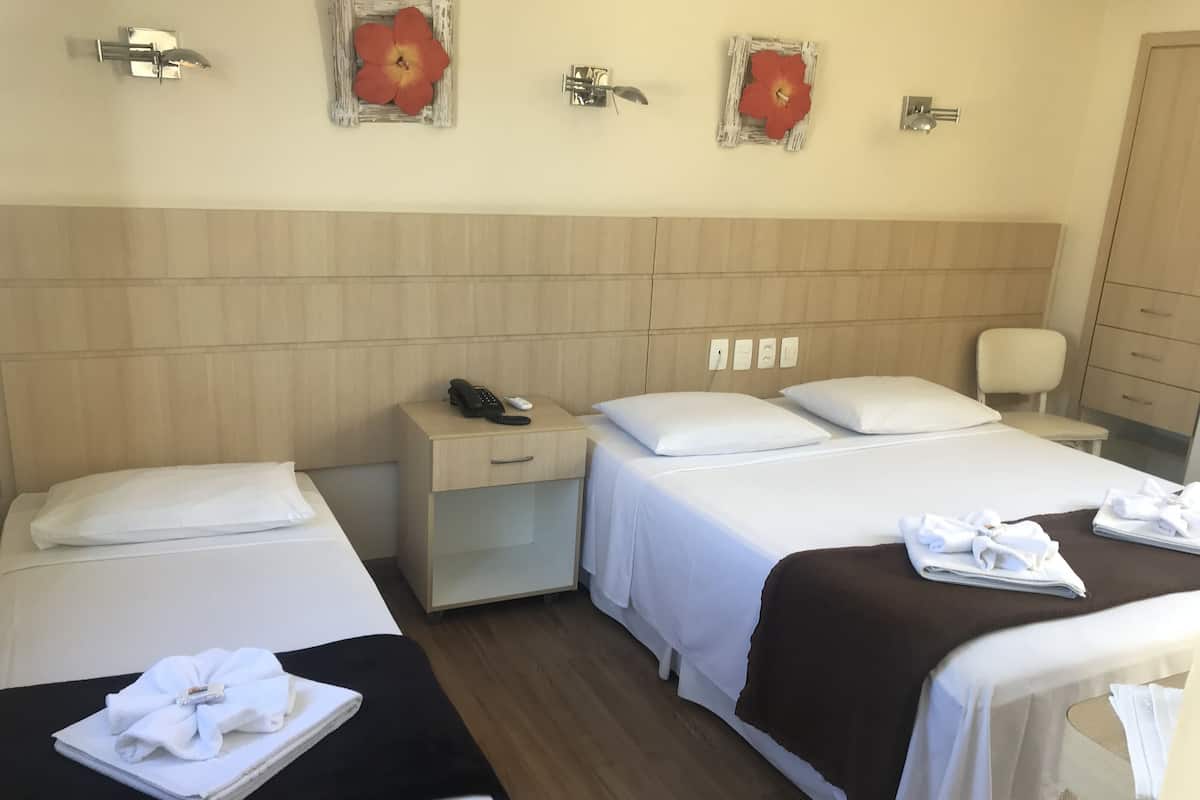 Triple Room | Minibar, in-room safe, blackout curtains, iron/ironing board