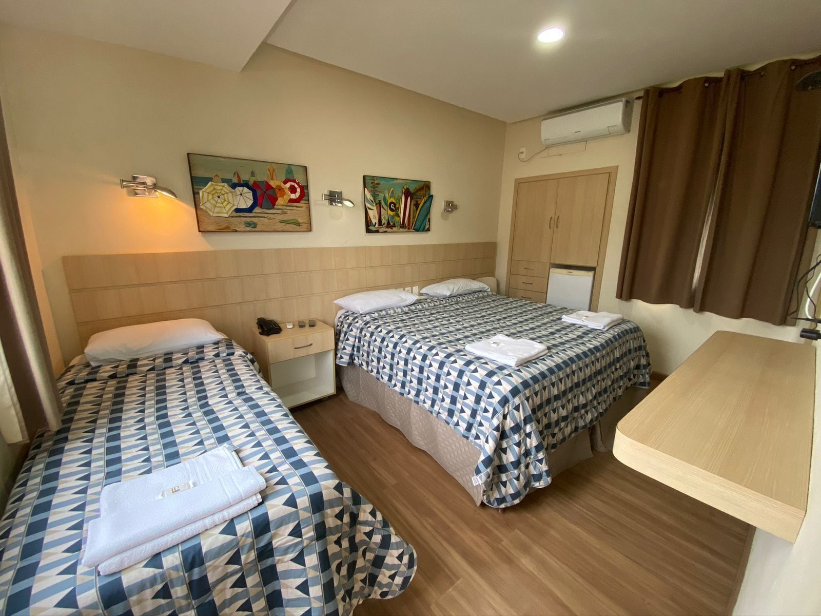 Triple Room | Minibar, in-room safe, blackout drapes, iron/ironing board