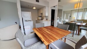 A compact kitchen with white cabinets and a white refrigerator. - Casey Key Resort  (Nokomis)