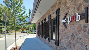 A building with a stone facade and a sign that reads "pub". - Pemberton Hotel (Pemberton)