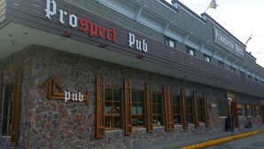 A building with a stone facade and multiple windows. The sign above reads "Prospect Pub." - Pemberton Hotel (Pemberton)