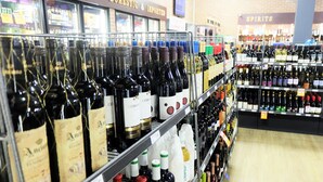 A wine store with shelves stocked with various bottles of wine. - Pemberton Hotel (Pemberton)