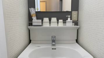 Shower, free toiletries, hair dryer, slippers