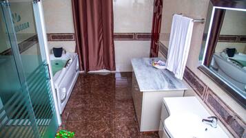 Combined shower/tub, free toiletries, bathrobes, slippers