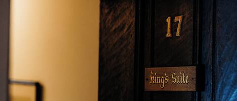 A door with the number 17 and the text "King's Suite" indicating a specific room.