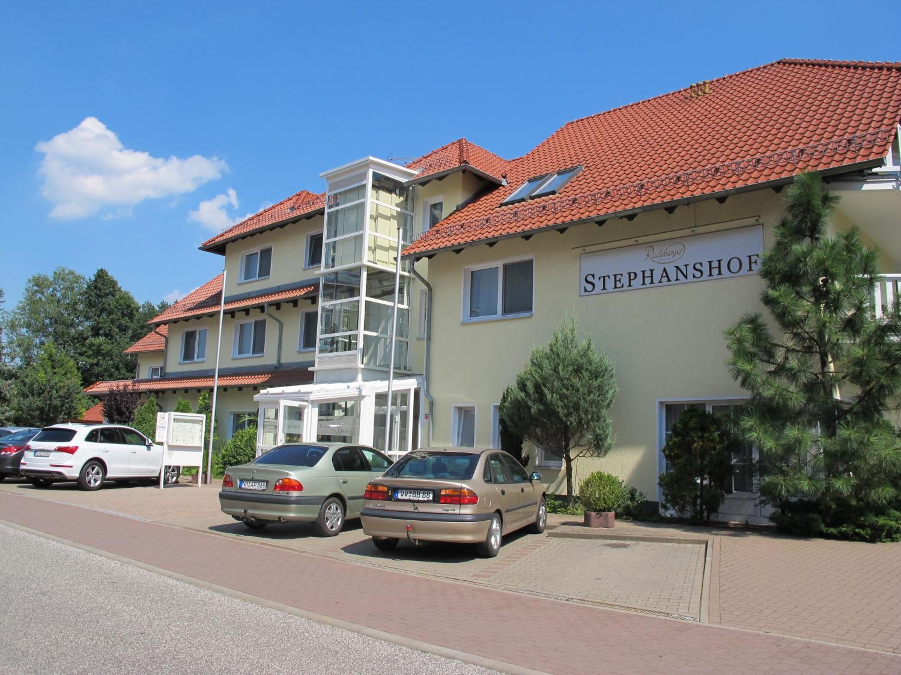 A building with a red-tiled roof and a sign reading "STEPHANSHOF".