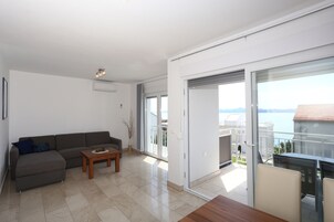 Panoramic Apartment, 1 Bedroom, Pool Access, Beachside | Living area | Flat-screen TV