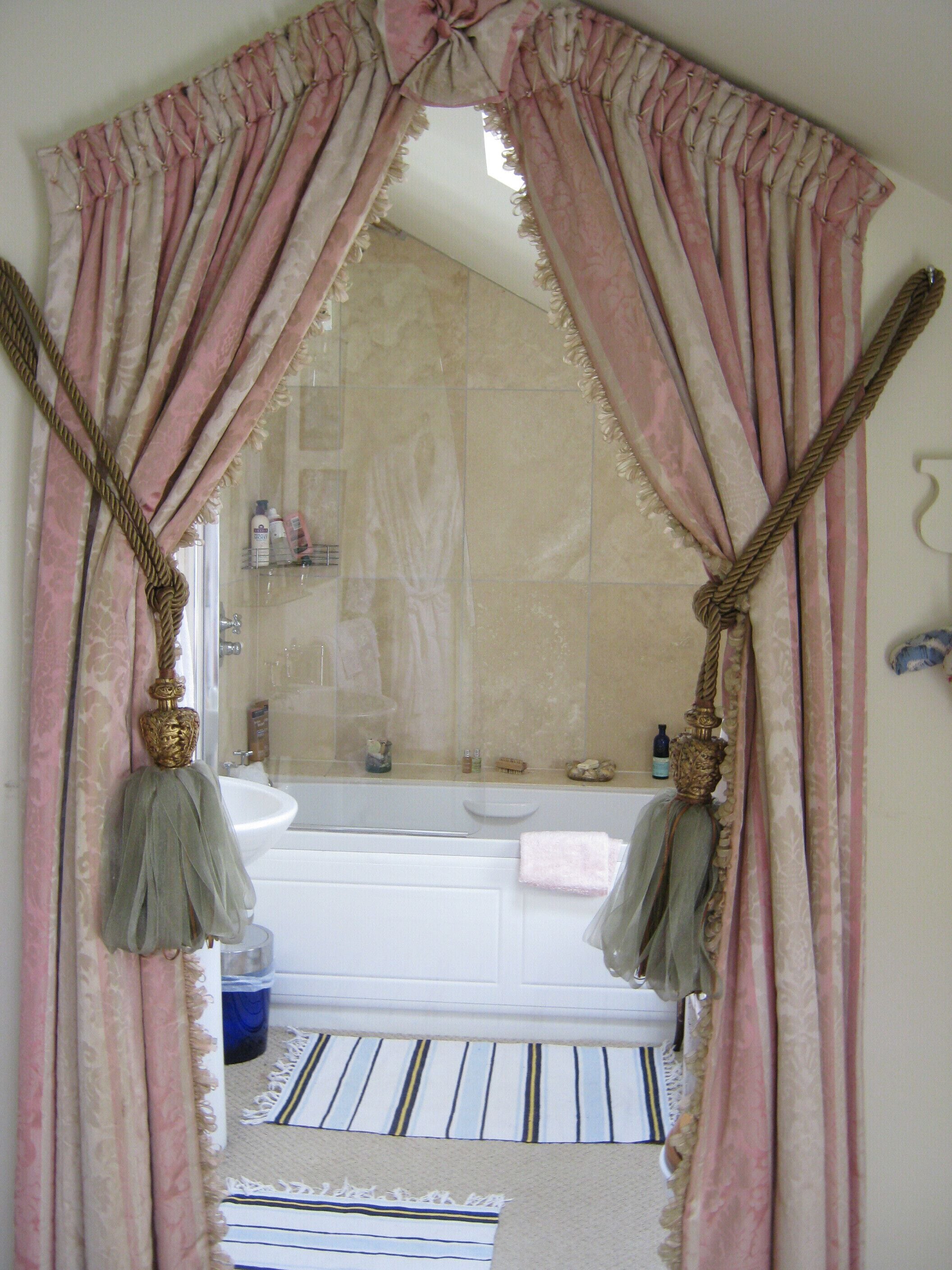 A bathroom with a bathtub, a sink, and a mirror.