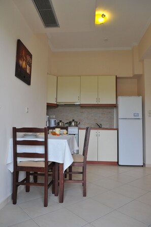 Apartment, 1 Bedroom, Sea View | Private kitchen | Full-size fridge, oven, stovetop, coffee/tea maker