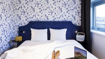 Luxe beddengoed, pillowtop-bedden, een kluis op de kamer, een bureau