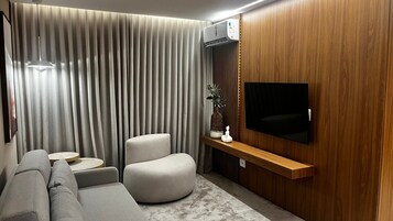 Suíte premium | Área de estar | TV